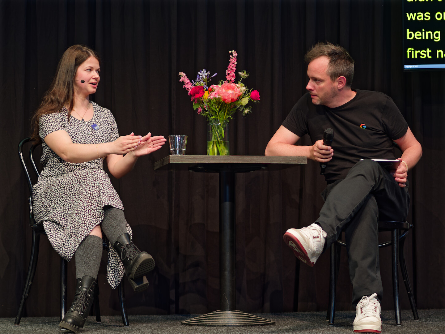 Me and Bramus sitting by a table having a Q&A session at CSS Day.